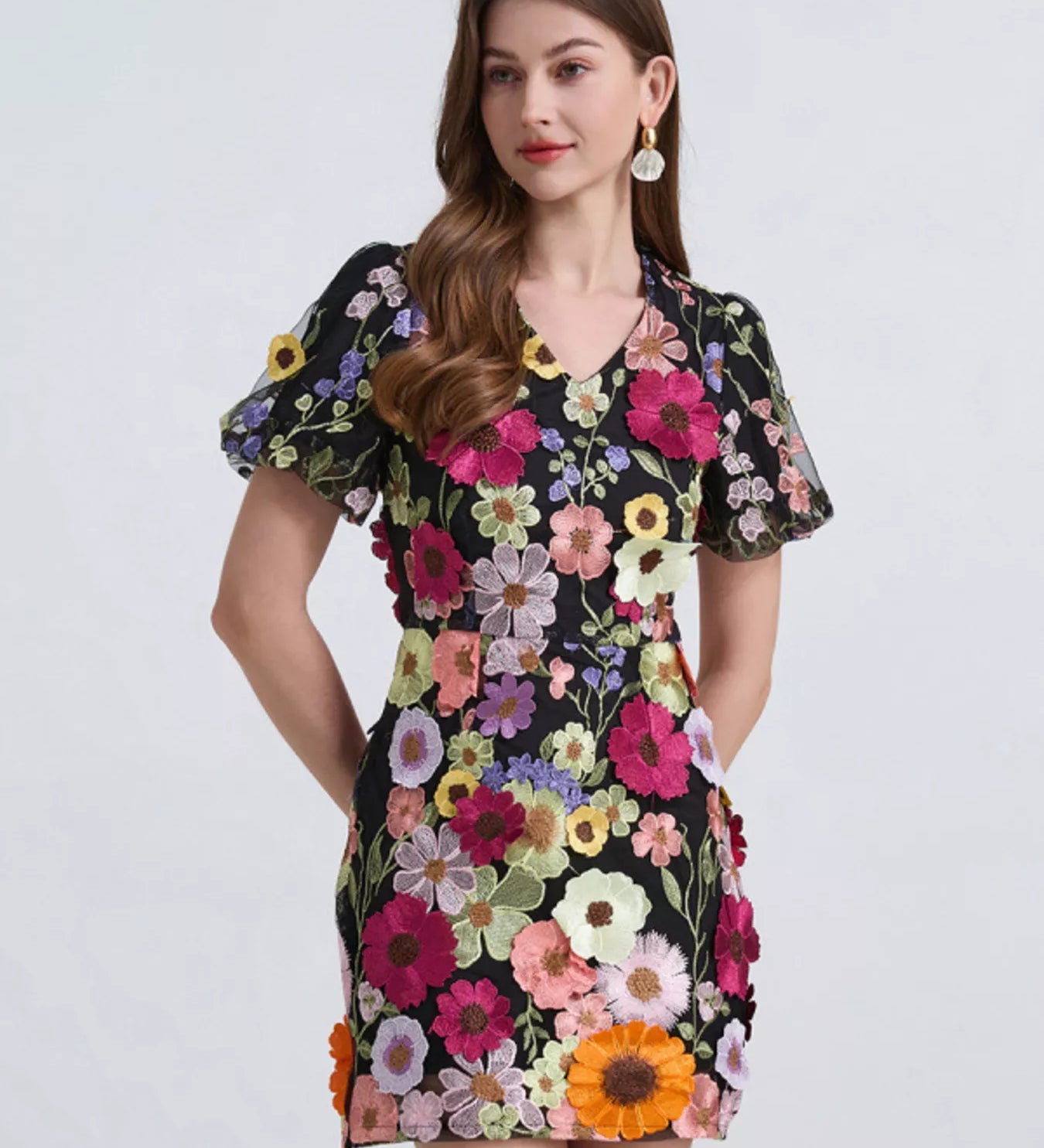 Floral puff sleeve mini homecoming dress shown as a short hoco dress option