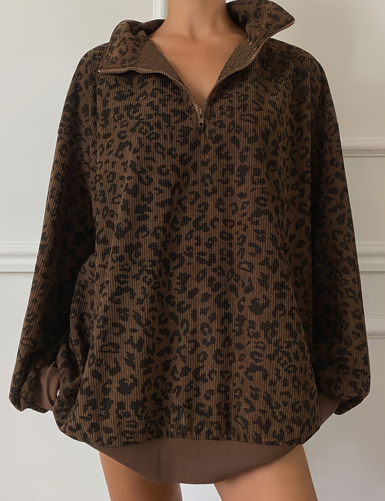 Oversized leopard quarter zip sweatshirt front view with dropped shoulders and roomy sleeves