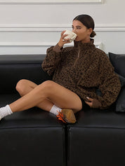 Leopard print quarter zip sweatshirt styled as an oversized casual layer