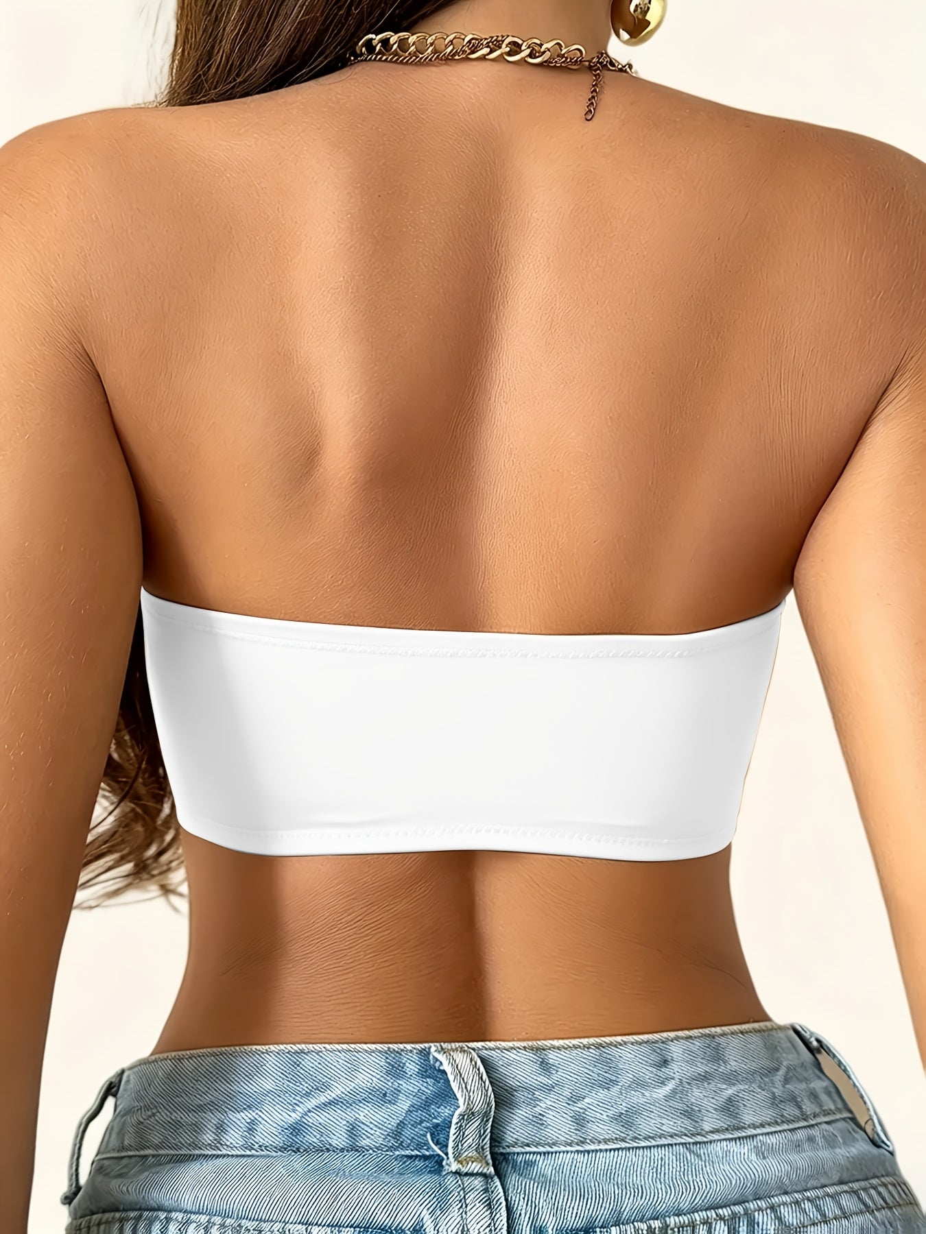 Strapless push up bra in white, back view showing the smooth strapless band