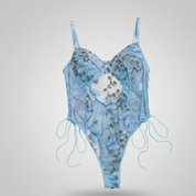 Blue lace lingerie set on a light gray background