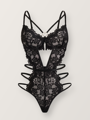 Black floral lace bodysuit shown on an invisible form, front view with gold heart ring and open cut-out waist