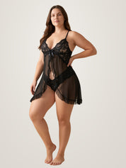Side three-quarter view of the black sheer babydoll slip showing the open front drape and ruffled hem - Chaotic Fashion