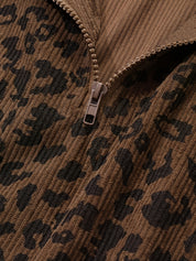 Close detail of the quarter zip pull and the waffle-textured leopard knit