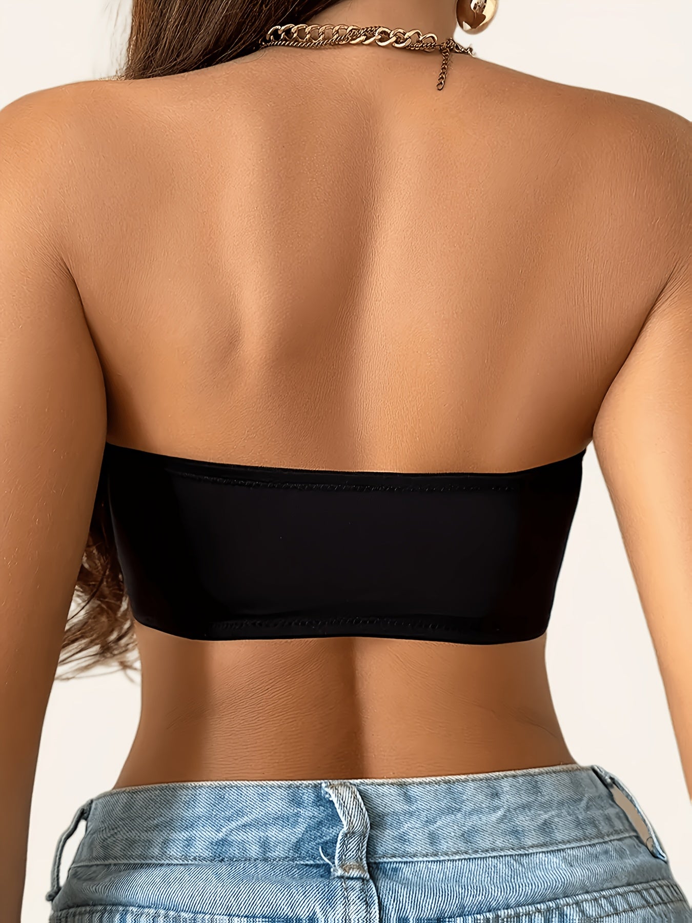 Strapless push up bra in black, back view showing the smooth strapless band
