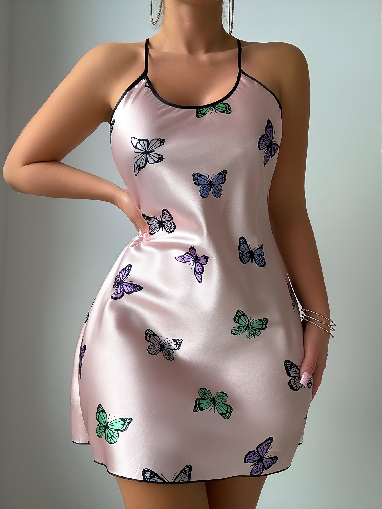 Blush satin chemise with butterfly print and black binding at the neckline