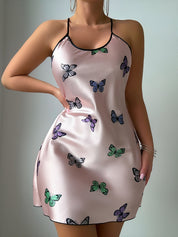 Blush satin chemise with butterfly print and black binding at the neckline
