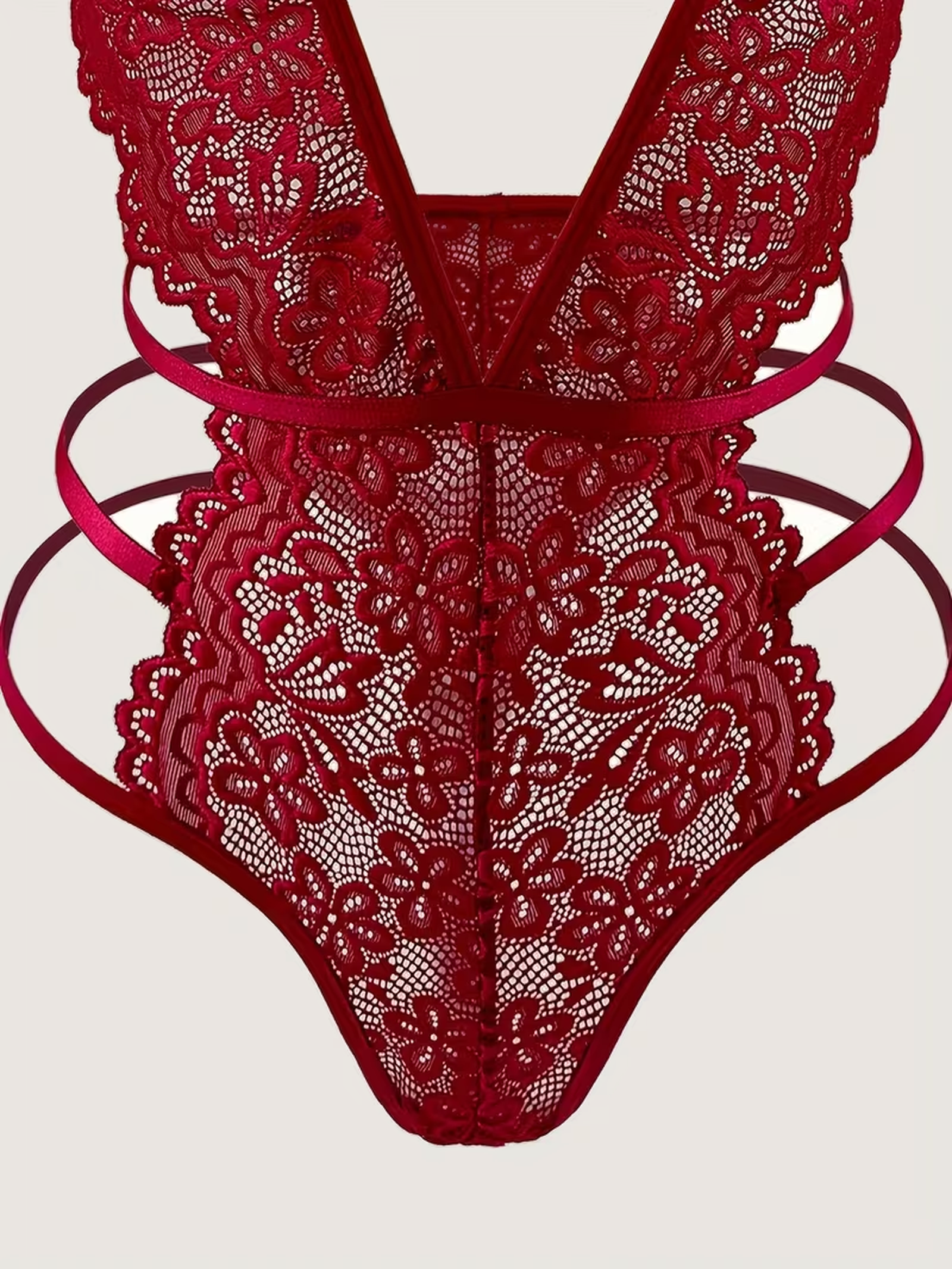 Red lace bodysuit hip strap and thong detail